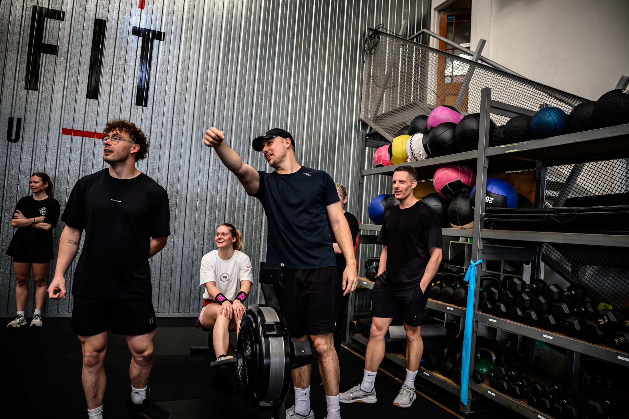 KnoxFit members training in front of the KnoxFit Whānau wall
